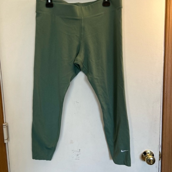 Nike Pants - Women's High-Waisted 7/8 Leggings green with white stitched logo